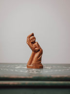 'In the Hand of God' Wooden Carved Figure