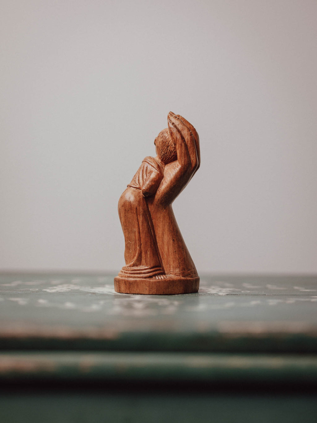 'In the Hand of God' Wooden Carved Figure