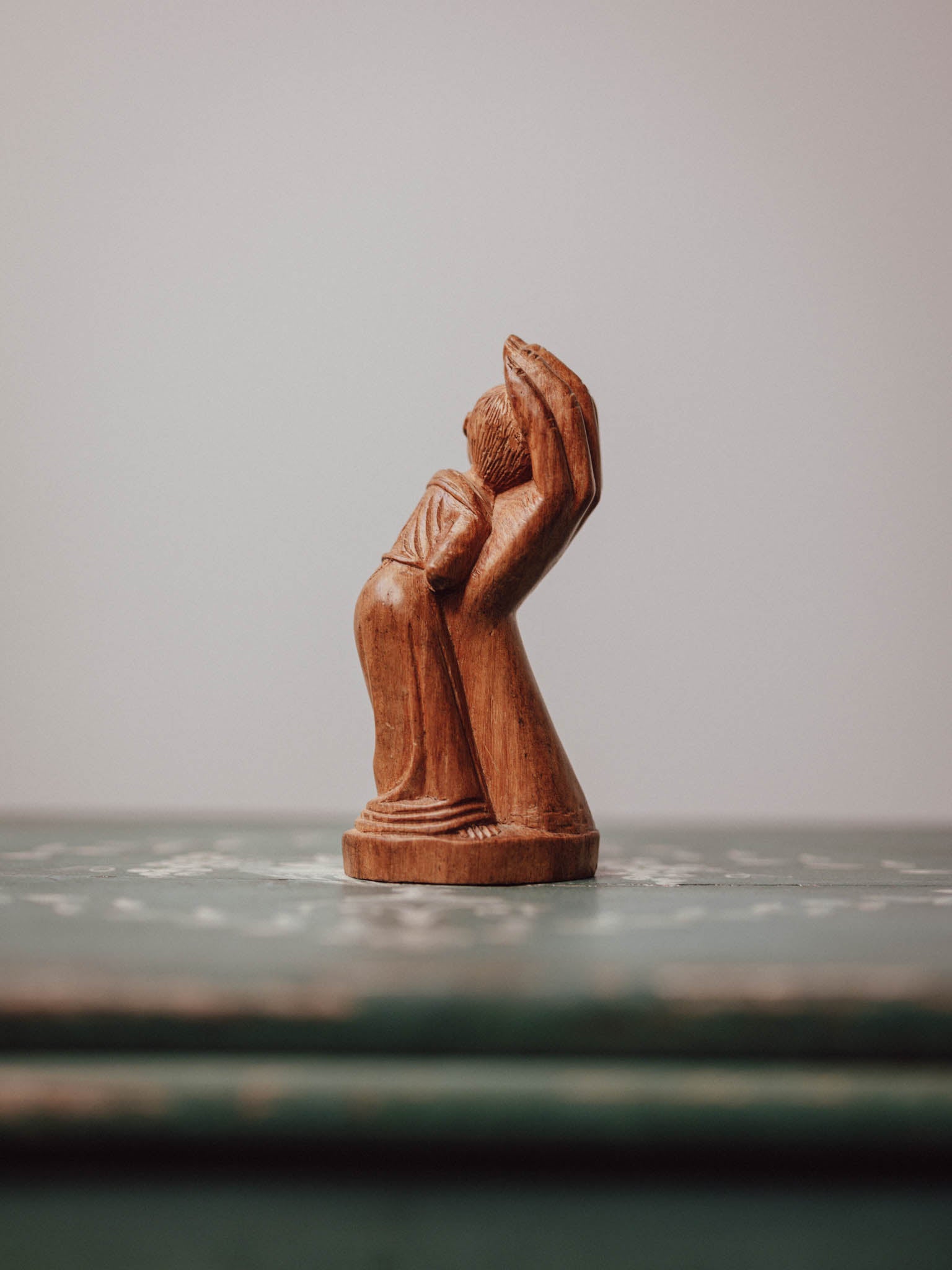 'In the Hand of God' Wooden Carved Figure