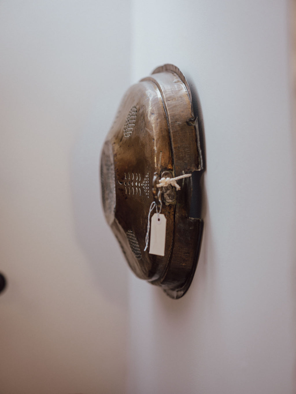 Antique Brass Meat Cover Repurposed as Wall Hanging