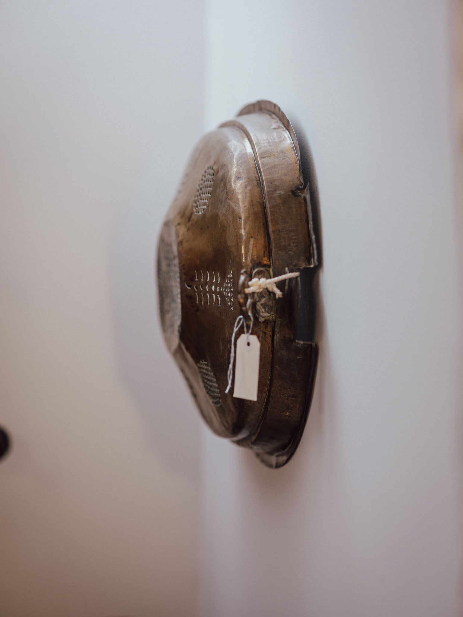 Antique Brass Meat Cover Repurposed as Wall Hanging
