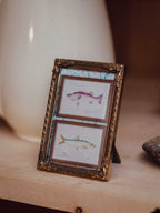 Miniature Brass Frame with Convex Glass and Fish