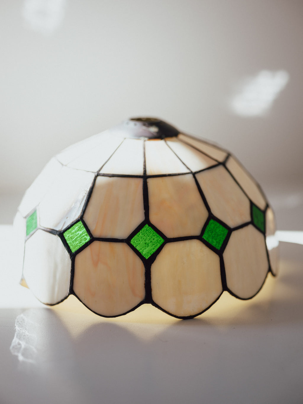 Decorative lamp with stained glass design on a white background