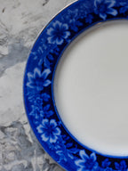 Blue floral-patterned saucer on a marble surface