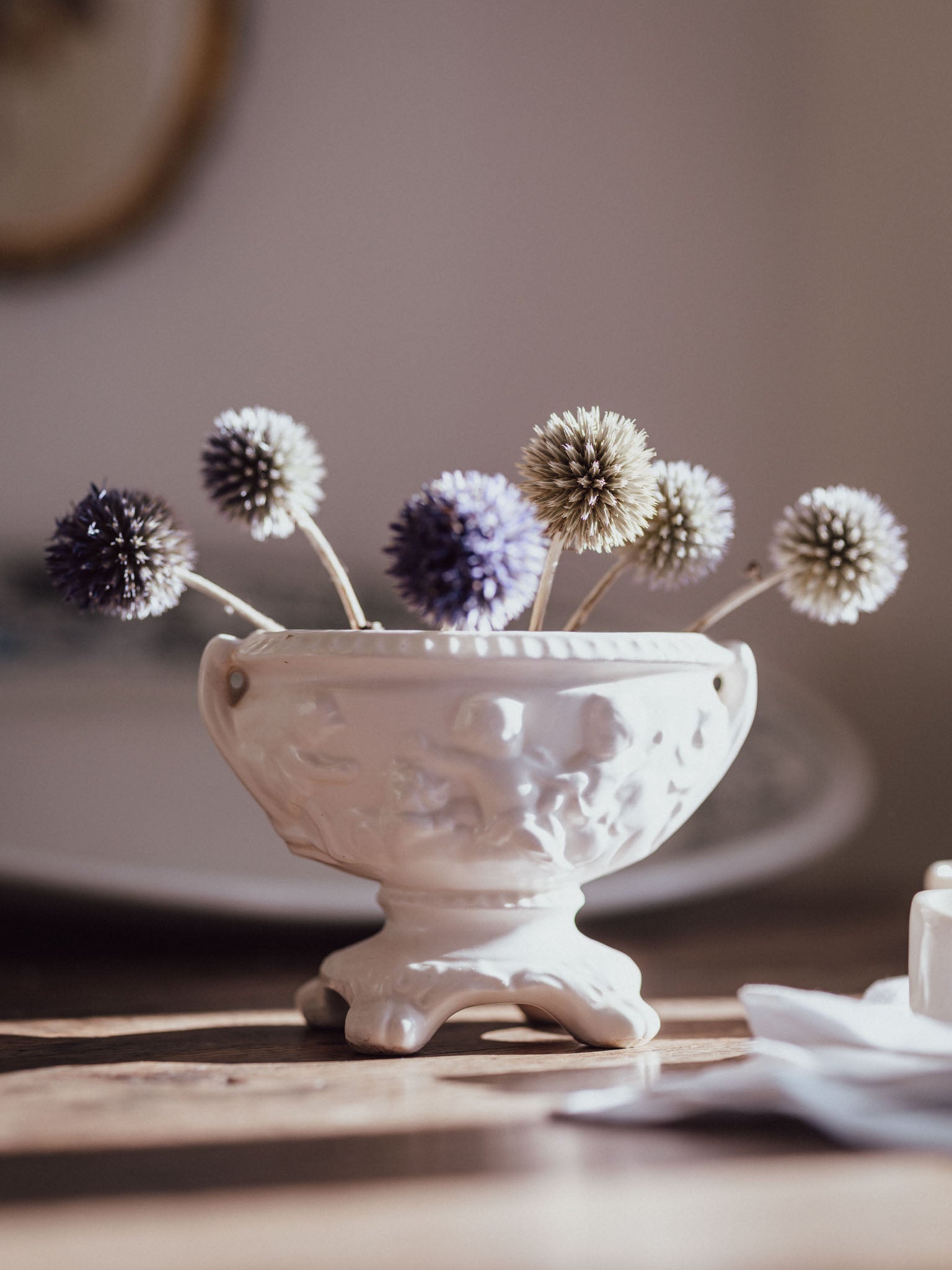 White Urn Vase with Cherubs & Glued-in Metal Flower Frog