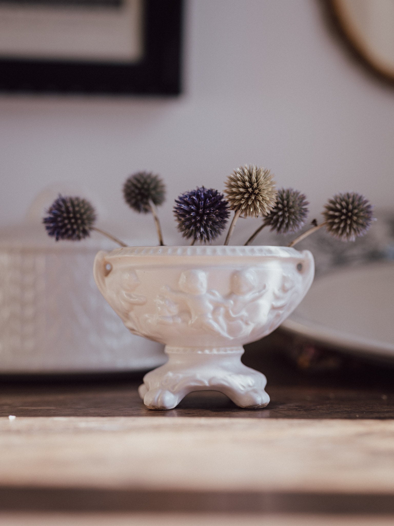 White Urn Vase with Cherubs & Glued-in Metal Flower Frog