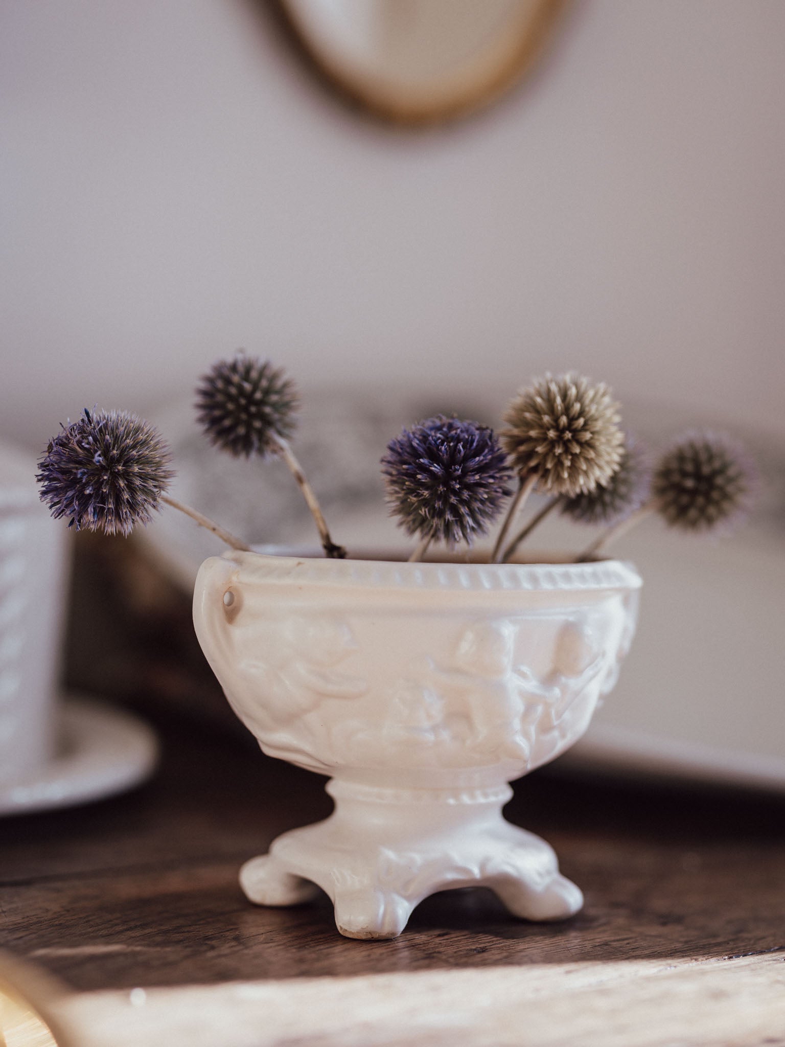White Urn Vase with Cherubs & Glued-in Metal Flower Frog