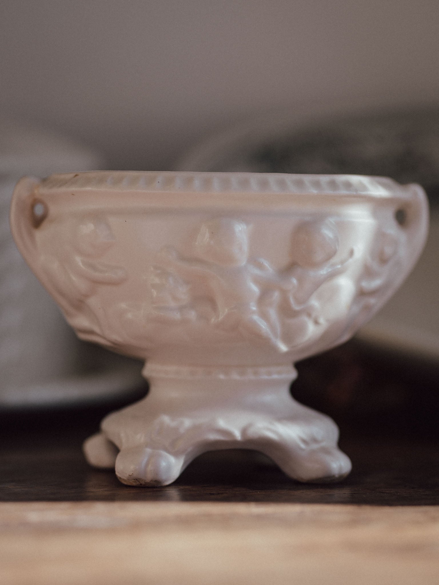 White Urn Vase with Cherubs & Glued-in Metal Flower Frog