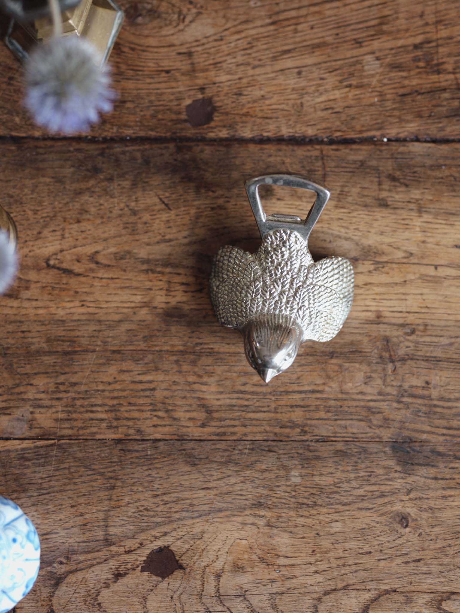 Mid-century metal bird bottle opener