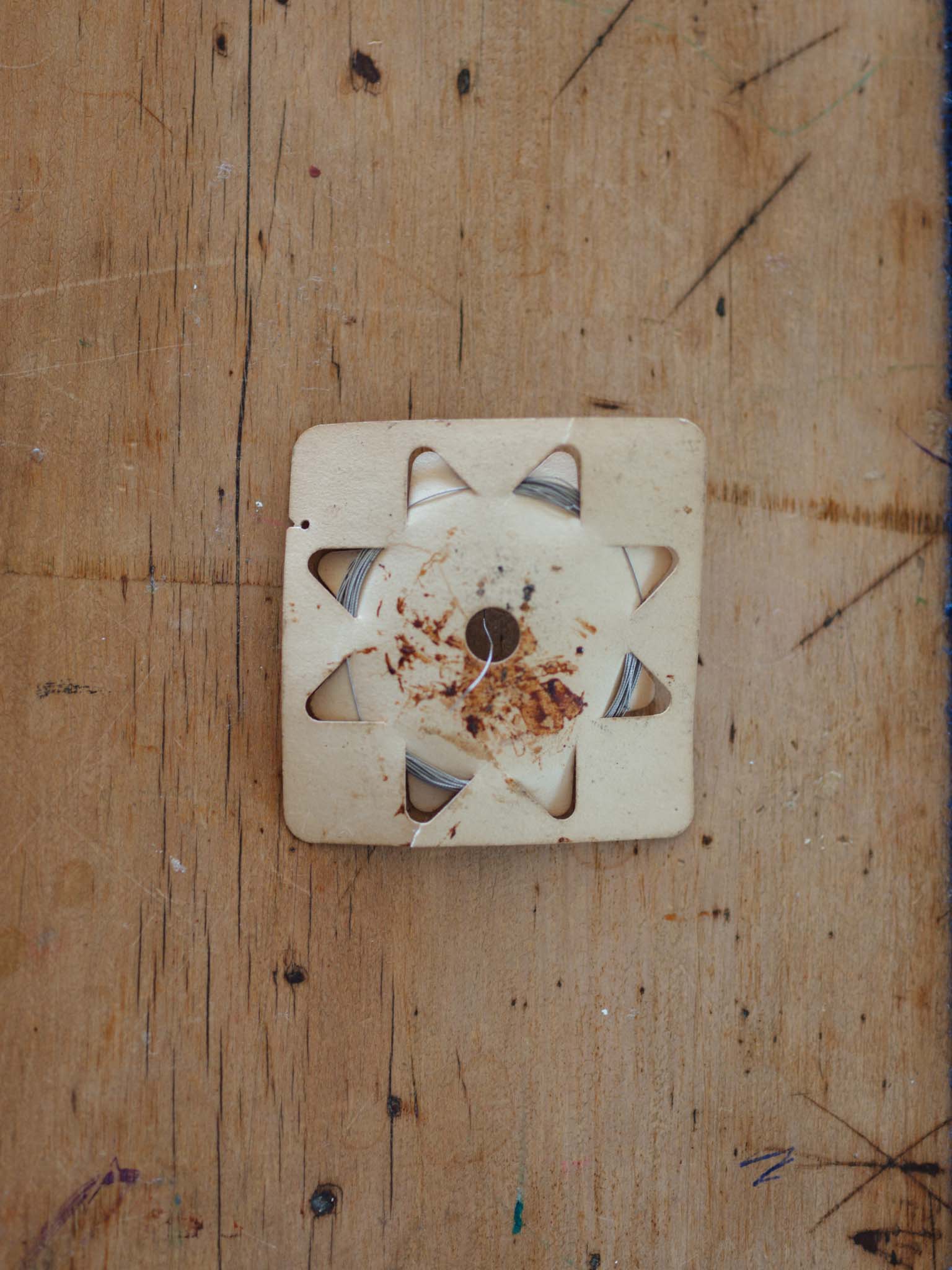 Antique stainless steel suture - original packaging