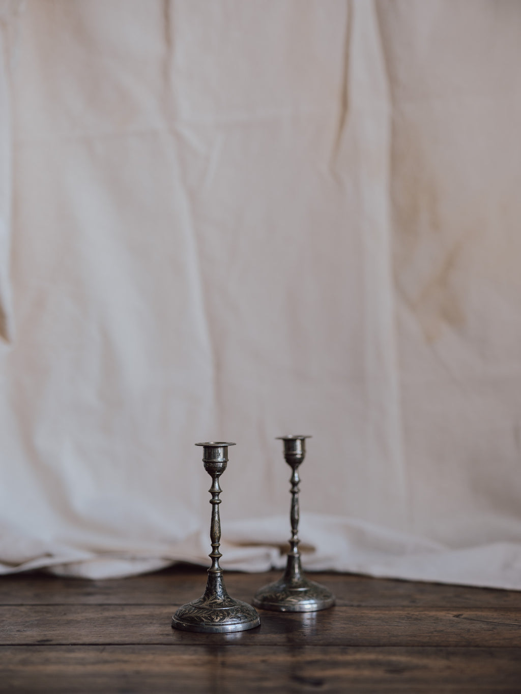 Silver-Washed Engraved Indian Candlesticks – Pair
