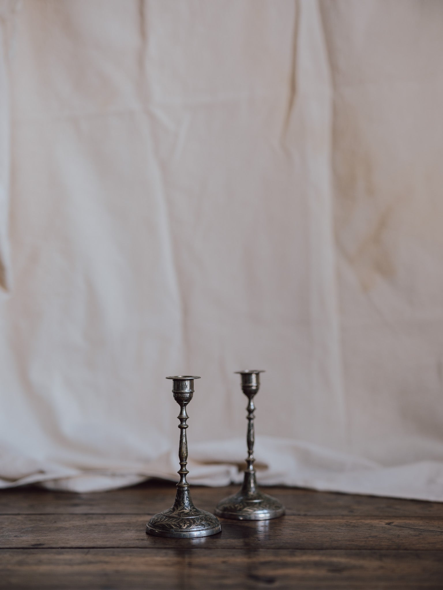 Silver-Washed Engraved Indian Candlesticks – Pair