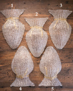 Vintage Murano glass wall sconce with ribbed clear glass and gold ribbon detailing. Italian mid-century wall light, hand-blown using the Graniglia technique. Mounted on a light grey backplate with brass fittings, perfect for hallways, bedrooms, or statement lighting.