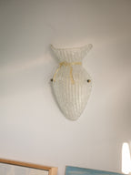 Vintage Murano glass wall sconce with ribbed clear glass and gold ribbon detailing. Italian mid-century wall light, hand-blown using the Graniglia technique. Mounted on a light grey backplate with brass fittings, perfect for hallways, bedrooms, or statement lighting.
